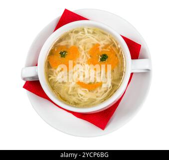 Restourant serving dish for child`s menu - noodles soup with face Stock Photo